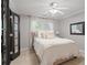 This bedroom features a ceiling fan, dark trim, and a nice window view at 1755 Noblin Summit Dr, Duluth, GA 30097