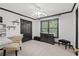 This bedroom features a desk area, a ceiling fan, and a nice window view at 1755 Noblin Summit Dr, Duluth, GA 30097