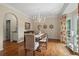 Elegant dining room with hardwood floors, chandelier, and natural light, creating a perfect ambiance for Gathering gatherings at 1755 Noblin Summit Dr, Duluth, GA 30097