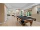 Spacious game room featuring a pool table and a partial view of an adjacent living area at 1755 Noblin Summit Dr, Duluth, GA 30097