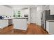 Bright kitchen with stainless steel appliances, island, and ample counter space at 1755 Noblin Summit Dr, Duluth, GA 30097
