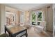 Bright living area featuring a window, comfortable seating, and tasteful decor, creating an inviting and relaxing atmosphere at 1755 Noblin Summit Dr, Duluth, GA 30097