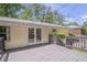 View of the back deck featuring string lights, access to the home, and yard at 2070 Drew Valley Ne Rd, Brookhaven, GA 30319
