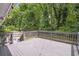 Large, well-maintained back deck surrounded by lush trees and greenery for outdoor enjoyment at 2070 Drew Valley Ne Rd, Brookhaven, GA 30319