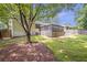 A well-maintained backyard features a wooden deck and a lush lawn, ideal for relaxation and recreation at 2070 Drew Valley Ne Rd, Brookhaven, GA 30319