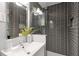 Modern bathroom featuring gray tiled walls, updated vanity, and fixtures at 2070 Drew Valley Ne Rd, Brookhaven, GA 30319