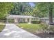 Charming home featuring beautiful landscaping, a long driveway, and great curb appeal at 2070 Drew Valley Ne Rd, Brookhaven, GA 30319