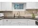 Updated kitchen with stainless steel appliances, white cabinetry, and sleek countertops at 2070 Drew Valley Ne Rd, Brookhaven, GA 30319