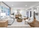 Bright and airy living room with stylish decor, hardwood floors, and large windows at 2070 Drew Valley Ne Rd, Brookhaven, GA 30319