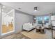 Cozy living room with white painted brick walls, neutral decor, and ample natural light, creating a relaxing space at 2070 Drew Valley Ne Rd, Brookhaven, GA 30319