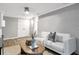 Cozy living room featuring brick wall, neutral tones, and comfortable seating, creating a relaxing and inviting atmosphere at 2070 Drew Valley Ne Rd, Brookhaven, GA 30319