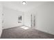 Spacious bedroom featuring gray carpet, white walls, and a view from the window at 2860 3Rd Sw Ave, Atlanta, GA 30315