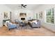 Inviting living room with large windows, fireplace, and hardwood floors at 2860 3Rd Sw Ave, Atlanta, GA 30315
