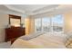 Bright bedroom with a large dresser, big windows, and a comfortable bed at 4879 Seldon Se Way, Smyrna, GA 30080