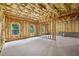 Unfinished basement with exposed framing, insulation, and natural light at 1648 Danbury Parc Ne Pl, Brookhaven, GA 30319