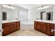 Bright bathroom features double vanities and a soaking tub in front of a sunny window at 1648 Danbury Parc Ne Pl, Brookhaven, GA 30319