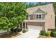 Charming two-story brick home with attached two-car garage and well-maintained landscaping at 1648 Danbury Parc Ne Pl, Brookhaven, GA 30319