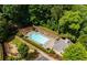 Aerial view of a community pool surrounded by lush greenery and lounge chairs at 1648 Danbury Parc Ne Pl, Brookhaven, GA 30319