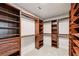 Spacious walk-in closet with custom shelving and drawers providing ample storage space at 1648 Danbury Parc Ne Pl, Brookhaven, GA 30319