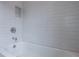 Clean bathroom features white subway tile surround and built in shower niche at 2164 James Aly, Atlanta, GA 30345