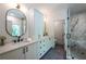 Elegant bathroom with dual sinks, marble countertops, and a glass-enclosed shower at 2164 James Aly, Atlanta, GA 30345