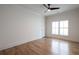 Bright, minimalist bedroom with hardwood floors, ceiling fan and natural light at 2164 James Aly, Atlanta, GA 30345