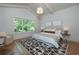 Bright bedroom featuring a large window, vaulted ceilings, and stylish decor at 2164 James Aly, Atlanta, GA 30345
