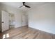 Neutral bedroom featuring wood floors, ceiling fan, and walk in closet at 2164 James Aly, Atlanta, GA 30345