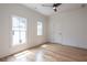 Bright bedroom with two windows, ceiling fan, and natural light at 2164 James Aly, Atlanta, GA 30345