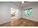 Bedroom featuring hardwood floors, a ceiling fan, and doorway view to an adjoining office at 2164 James Aly, Atlanta, GA 30345