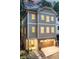 Stylish three-story home features a two-car garage, manicured landscaping, and craftsman-style architecture at 2164 James Aly, Atlanta, GA 30345