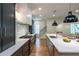 Spacious kitchen with stainless steel appliances, marble backsplash and an island with barstool seating at 2164 James Aly, Atlanta, GA 30345