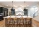 Bright kitchen features a large island with seating, stainless steel appliances and sleek cabinets at 2164 James Aly, Atlanta, GA 30345