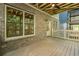 Outdoor porch featuring a brick foundation, natural wood ceiling, and backyard views at 2164 James Aly, Atlanta, GA 30345
