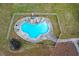 Overhead view of kidney-shaped in-ground pool with fence at 805 Wesley Oak Rd, Atlanta, GA 30328