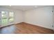 Finished basement with walkout to backyard through double doors and bright lighting at 805 Wesley Oak Rd, Atlanta, GA 30328