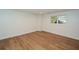 Bright basement with wood floors, recessed lights, and a view to the backyard through a window at 805 Wesley Oak Rd, Atlanta, GA 30328