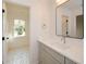 Bathroom with quartz countertop vanity, large mirror and open view at 805 Wesley Oak Rd, Atlanta, GA 30328