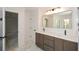 This bathroom features double sinks, and the countertop is a beautiful marble at 805 Wesley Oak Rd, Atlanta, GA 30328