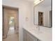 Bright bathroom with a stone countertop and open view to another room at 805 Wesley Oak Rd, Atlanta, GA 30328