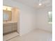 This bedroom features a ceiling fan and windows to the outdoors at 805 Wesley Oak Rd, Atlanta, GA 30328
