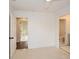 This bedroom features multiple doorways to other rooms, and hardwood flooring at 805 Wesley Oak Rd, Atlanta, GA 30328