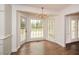 Bright breakfast nook featuring a bay window with views of the backyard pool area and access to the deck at 805 Wesley Oak Rd, Atlanta, GA 30328