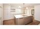 Well-designed kitchen with an island, custom cabinets, and hardwood floors at 805 Wesley Oak Rd, Atlanta, GA 30328