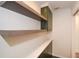 The laundry room features ample shelving, a counter, and cabinets for organized storage at 805 Wesley Oak Rd, Atlanta, GA 30328