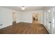 Open-concept living area with hardwood floors, detailed molding, and seamless flow into the kitchen at 805 Wesley Oak Rd, Atlanta, GA 30328