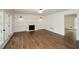 Bright living room features hardwood floors, fireplace, and French doors that fill the room with natural light at 805 Wesley Oak Rd, Atlanta, GA 30328