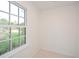 Bright sitting room with hardwood floors and a large window offering backyard views at 805 Wesley Oak Rd, Atlanta, GA 30328
