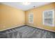 Bedroom featuring carpet, two windows, and neutral paint at 1235 Renaissance Se Ct, Mableton, GA 30126