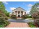 Impressive clubhouse with stately columns and manicured landscaping, offering residents a luxurious gathering space at 1235 Renaissance Se Ct, Mableton, GA 30126